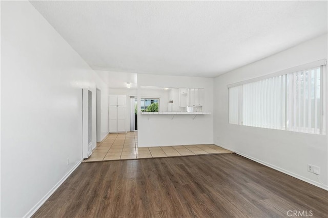 841 W 5th, San Pedro, CA 90731 - unfurnished living room with a heating unit and wood finished floors