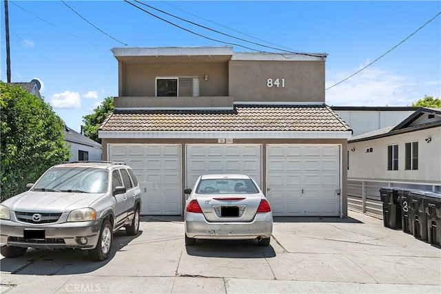 841 W 5th, San Pedro, CA 90731 - view of front of property featuring stucco siding, driveway, a garage, and a tiled roof