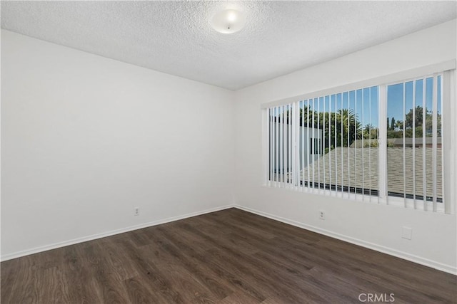 841 W 5th, San Pedro, CA 90731 - spare room featuring dark wood-type flooring and a textured ceiling