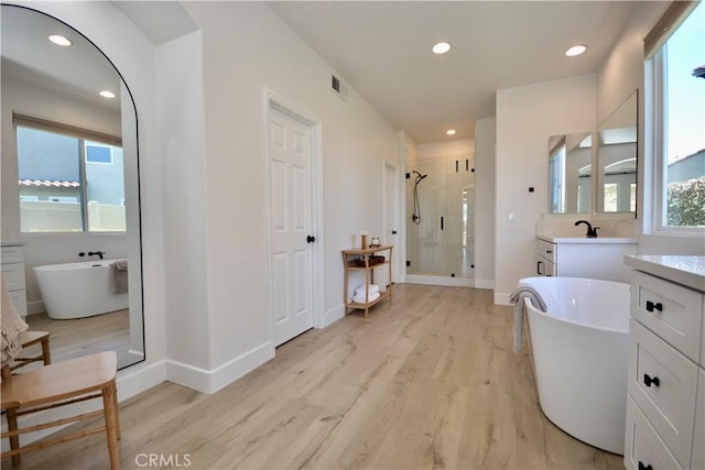 45605 Corte Royal, Temecula, CA 92592 - bathroom featuring a shower stall, vanity, wood finished floors, recessed lighting, and a soaking tub