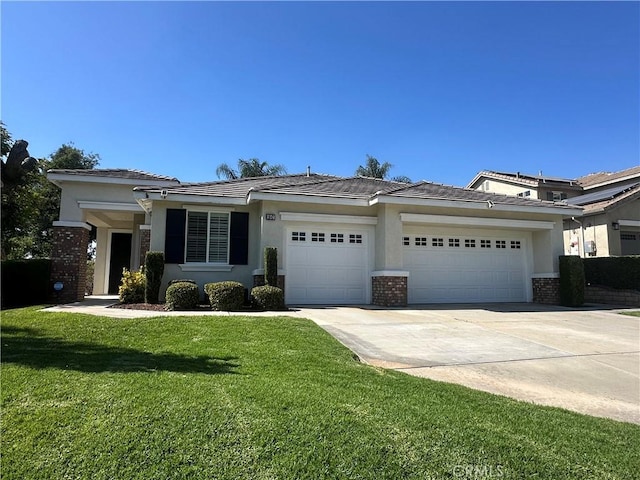 1647 Naranjo Ct, Redlands, CA 92374 - view of front of house featuring a garage, driveway, and stucco siding