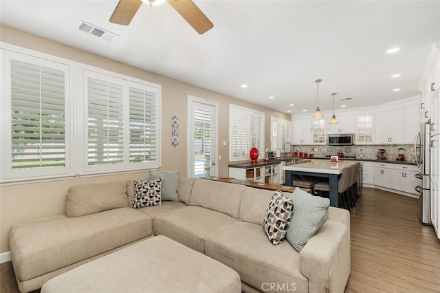1647 Naranjo Ct, Redlands, CA 92374 - living room featuring dark wood-type flooring, ceiling fan, and recessed lighting