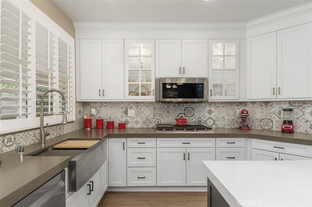 1647 Naranjo Ct, Redlands, CA 92374 - kitchen featuring appliances with stainless steel finishes, white cabinetry, and glass insert cabinets