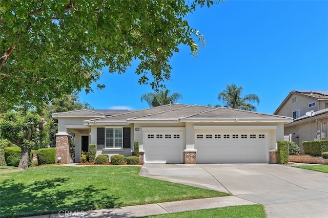 1647 Naranjo Ct, Redlands, CA 92374 - view of front of property with an attached garage, concrete driveway, a front lawn, stucco siding, and a tiled roof