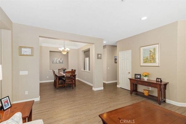 1647 Naranjo Ct, Redlands, CA 92374 - living room featuring a chandelier, light wood finished floors, and recessed lighting