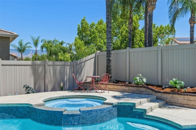 1647 Naranjo Ct, Redlands, CA 92374 - view of pool featuring a fenced backyard and a pool with connected hot tub