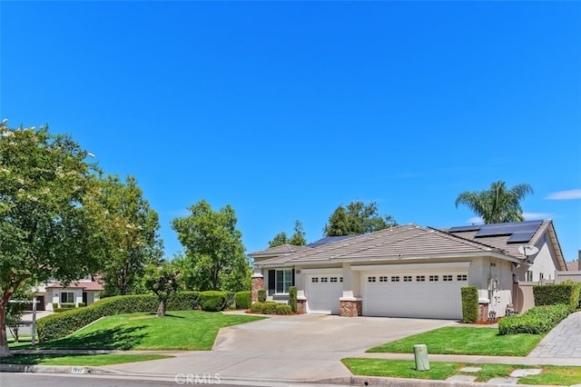 1647 Naranjo Ct, Redlands, CA 92374 - view of front of home with a garage, a front lawn, driveway, stucco siding, and a tile roof