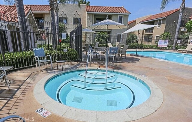 10166 Camino Ruiz Unit 32, San Diego, CA 92126 - community pool with a patio and a community hot tub