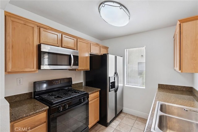 10166 Camino Ruiz Unit 32, San Diego, CA 92126 - kitchen with stainless steel microwave, black range with gas stovetop, refrigerator with ice dispenser, and dark countertops