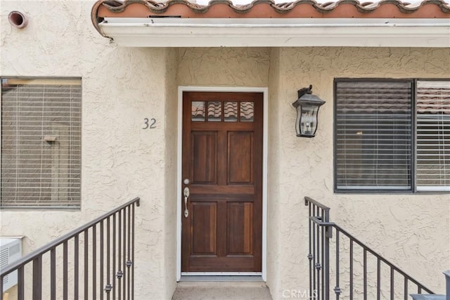 10166 Camino Ruiz Unit 32, San Diego, CA 92126 - view of exterior entry featuring stucco siding