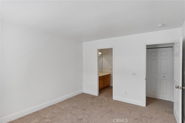 10166 Camino Ruiz Unit 32, San Diego, CA 92126 - unfurnished bedroom with light colored carpet and ensuite bath