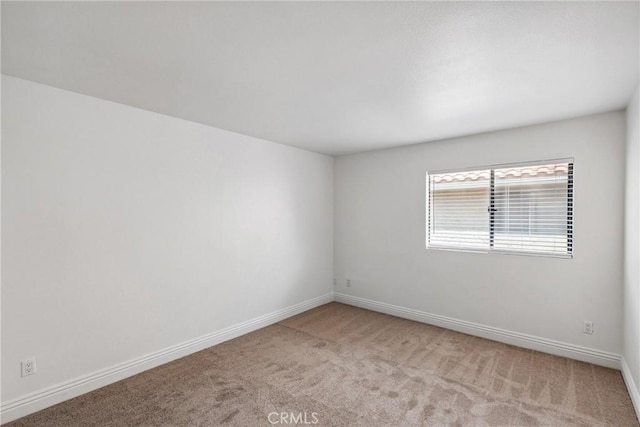 10166 Camino Ruiz Unit 32, San Diego, CA 92126 - unfurnished room with light colored carpet and baseboards