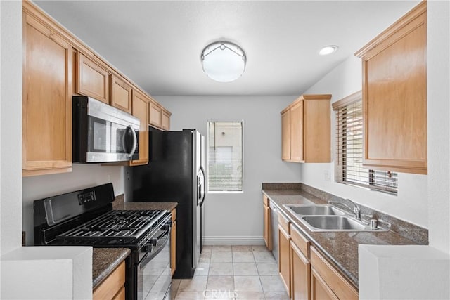 10166 Camino Ruiz Unit 32, San Diego, CA 92126 - kitchen with stainless steel appliances, dark countertops, light tile patterned floors, and light brown cabinetry