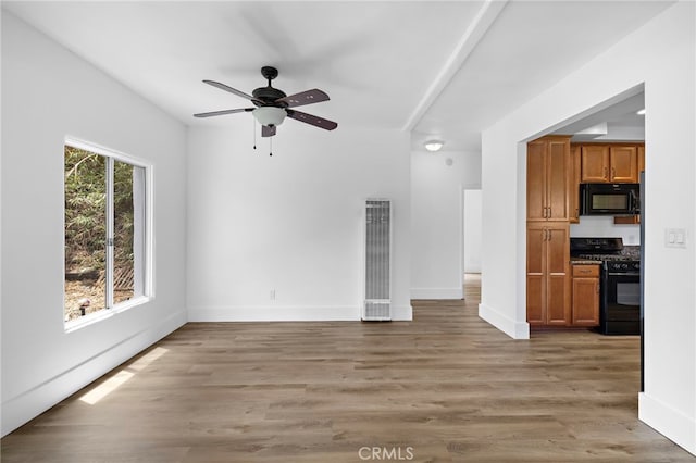 1509 N Avenida De La Estrella, San Clemente, CA 92672 - unfurnished living room featuring a heating unit, a ceiling fan, and light wood-style floors