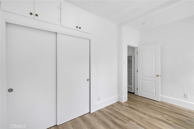 1509 N Avenida De La Estrella, San Clemente, CA 92672 - unfurnished bedroom with a heating unit, light wood-style floors, and a closet