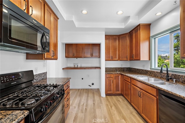 1509 N Avenida De La Estrella, San Clemente, CA 92672 - kitchen featuring black appliances, a tray ceiling, light wood finished floors, brown cabinets, and recessed lighting