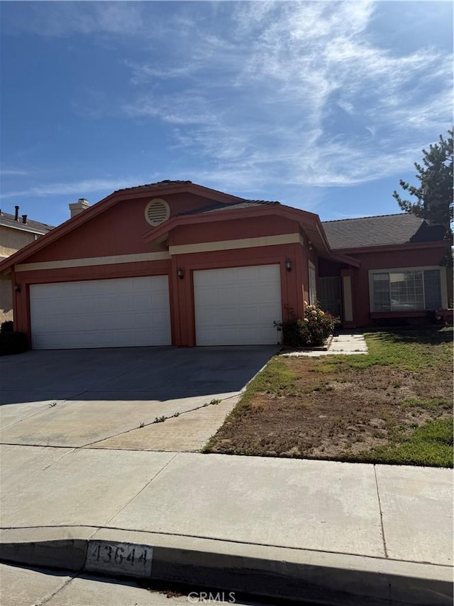 43644 Serenity Ct, Lancaster, CA 93535 - view of front of house with an attached garage and concrete driveway