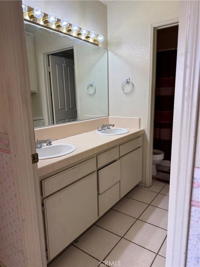43644 Serenity Ct, Lancaster, CA 93535 - full bath with double vanity and tile patterned flooring