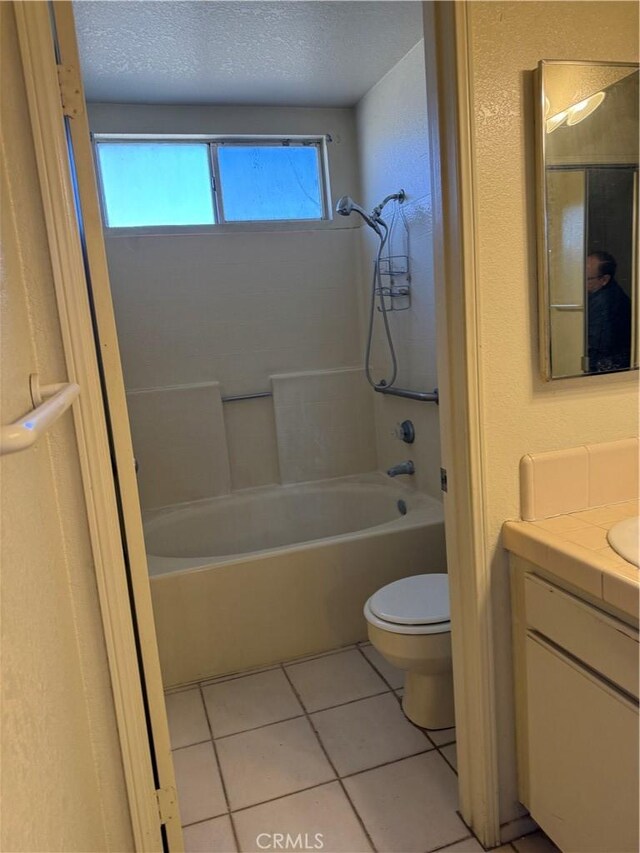 43644 Serenity Ct, Lancaster, CA 93535 - full bathroom featuring vanity, tub / shower combination, tile patterned floors, and a textured ceiling