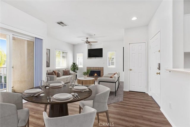 26390 Arboretum Way Unit 3004, Murrieta, CA 92563 - dining space featuring a ceiling fan, a lit fireplace, wood finished floors, and recessed lighting