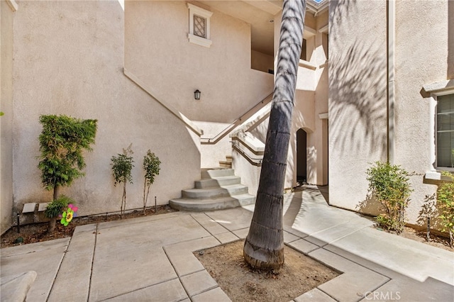 26390 Arboretum Way Unit 3004, Murrieta, CA 92563 - property entrance featuring stucco siding and a patio area