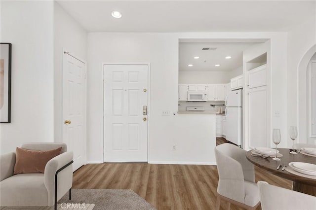 26390 Arboretum Way Unit 3004, Murrieta, CA 92563 - entryway featuring wood finished floors, arched walkways, and recessed lighting
