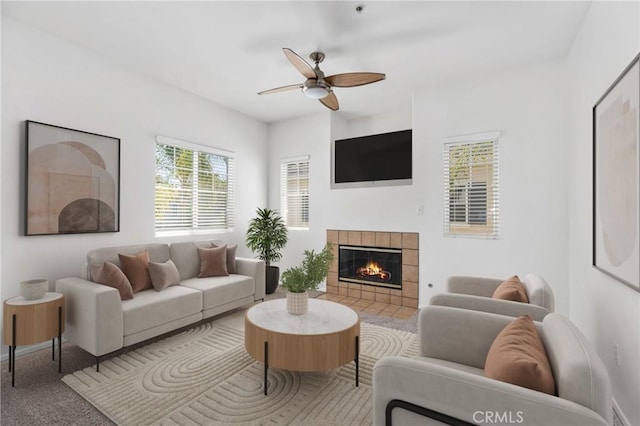26390 Arboretum Way Unit 3004, Murrieta, CA 92563 - living room with a ceiling fan, a tiled fireplace, and carpet
