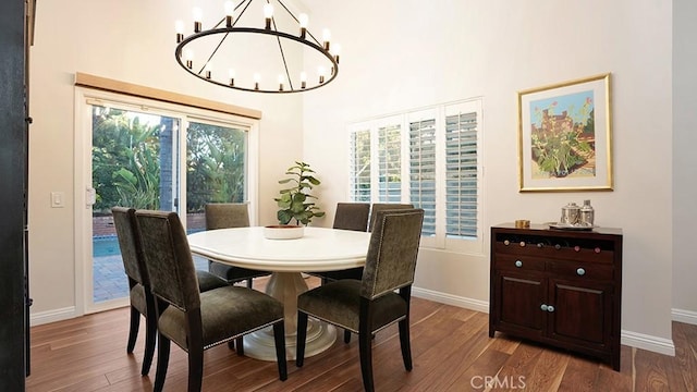 31962 Via Montura, San Juan Capistrano, CA 92675 - dining space with a chandelier, wood finished floors, and a towering ceiling