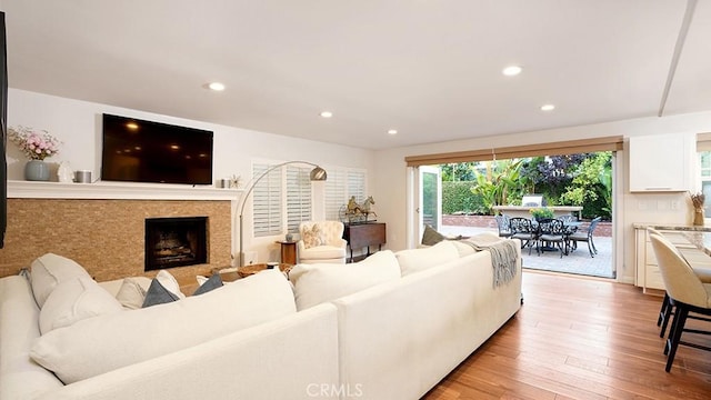 31962 Via Montura, San Juan Capistrano, CA 92675 - living area with light wood-style floors, recessed lighting, and a fireplace