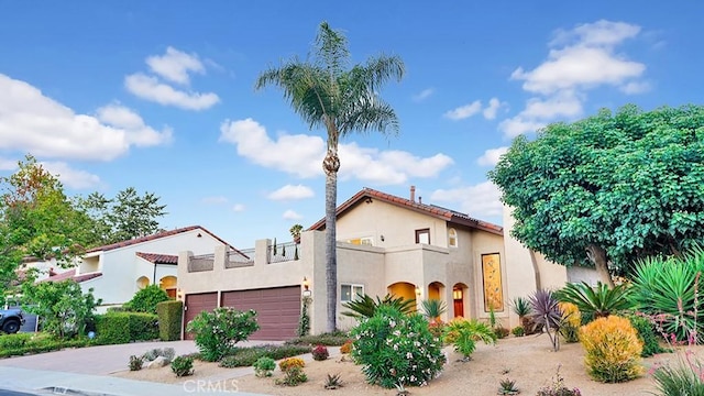 31962 Via Montura, San Juan Capistrano, CA 92675 - mediterranean / spanish-style house featuring a garage, stucco siding, and concrete driveway