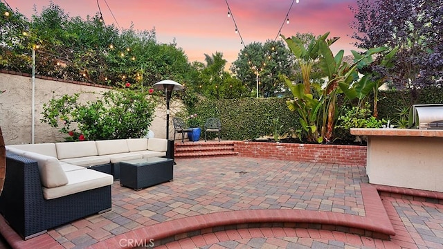 31962 Via Montura, San Juan Capistrano, CA 92675 - patio terrace at dusk with an outdoor hangout area and a patio