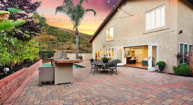 31962 Via Montura, San Juan Capistrano, CA 92675 - patio terrace at dusk with a patio, area for grilling, and outdoor dining space