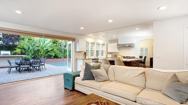 31962 Via Montura, San Juan Capistrano, CA 92675 - living area with dark wood-type flooring, recessed lighting, and arched walkways