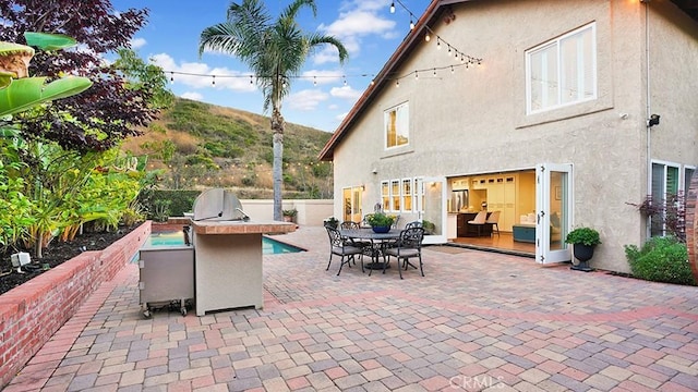 31962 Via Montura, San Juan Capistrano, CA 92675 - view of patio / terrace with an outdoor kitchen and outdoor dining space