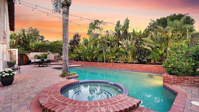 31962 Via Montura, San Juan Capistrano, CA 92675 - pool at dusk with a patio area and a pool with connected hot tub