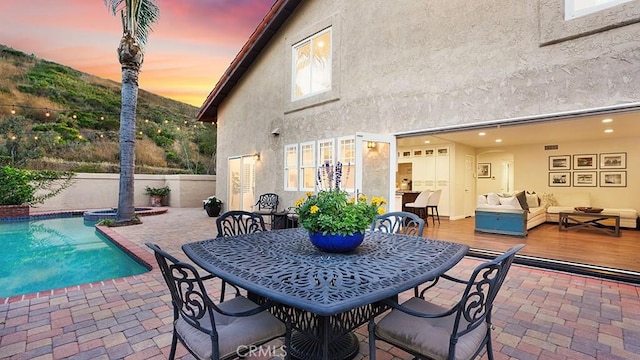 31962 Via Montura, San Juan Capistrano, CA 92675 - view of patio featuring outdoor lounge area, a pool with connected hot tub, and a deck