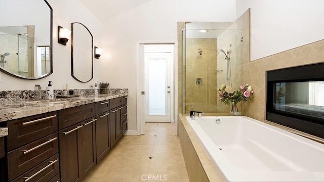 31962 Via Montura, San Juan Capistrano, CA 92675 - bathroom with vanity, lofted ceiling, a garden tub, a stall shower, and tile patterned flooring
