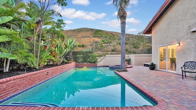 31962 Via Montura, San Juan Capistrano, CA 92675 - view of pool with a mountain view, a pool with connected hot tub, and a patio