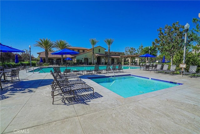 24270 Verdugo Cir, Valencia, CA 91354 - community pool with a patio area