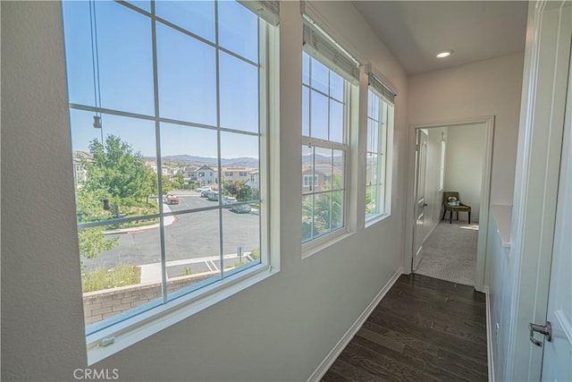 24270 Verdugo Cir, Valencia, CA 91354 - hall with healthy amount of natural light, dark wood-type flooring, and recessed lighting
