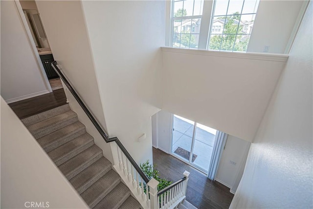 24270 Verdugo Cir, Valencia, CA 91354 - stairs with wood finished floors and a high ceiling