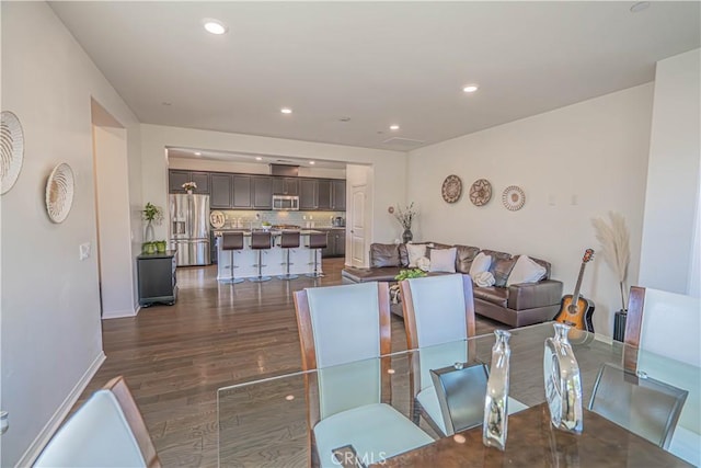 24270 Verdugo Cir, Valencia, CA 91354 - dining space with dark wood-style flooring and recessed lighting