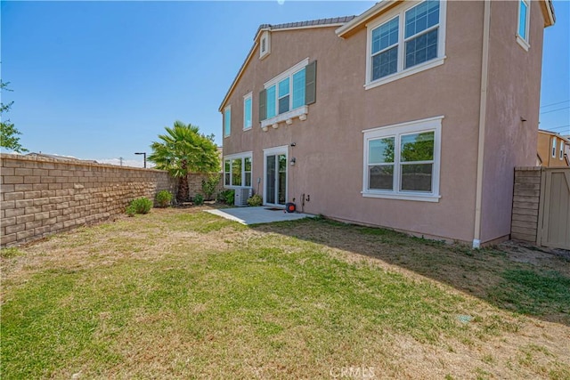 24270 Verdugo Cir, Valencia, CA 91354 - back of property featuring stucco siding, a fenced backyard, and a patio area