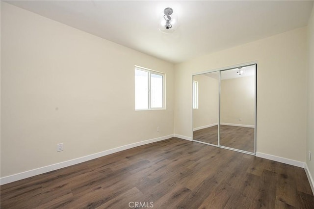 4548 Jade St, Los Angeles, CA 90032 - unfurnished bedroom with dark wood-style flooring and a closet