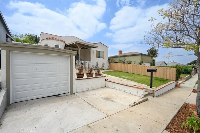 4548 Jade St, Los Angeles, CA 90032 - mediterranean / spanish-style home with stucco siding and an attached garage