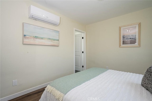 4548 Jade St, Los Angeles, CA 90032 - bedroom featuring a wall mounted AC and dark wood-style floors