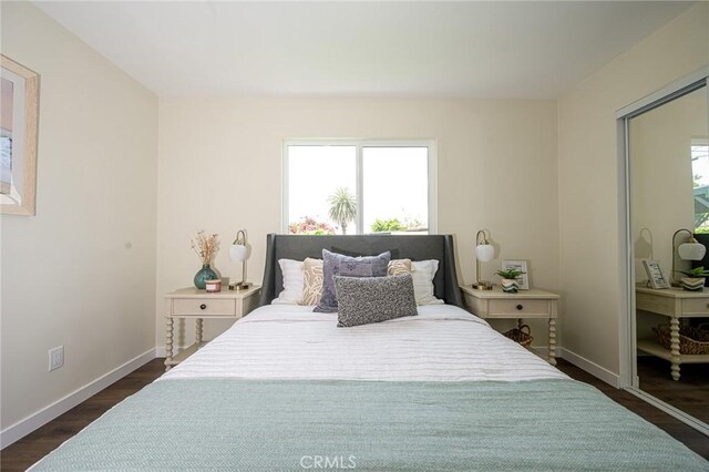 4548 Jade St, Los Angeles, CA 90032 - bedroom with multiple windows and dark wood-style flooring
