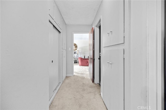 120 Alamitos Ave Unit 14, Long Beach, CA 90802 - hallway with a textured ceiling and light colored carpet