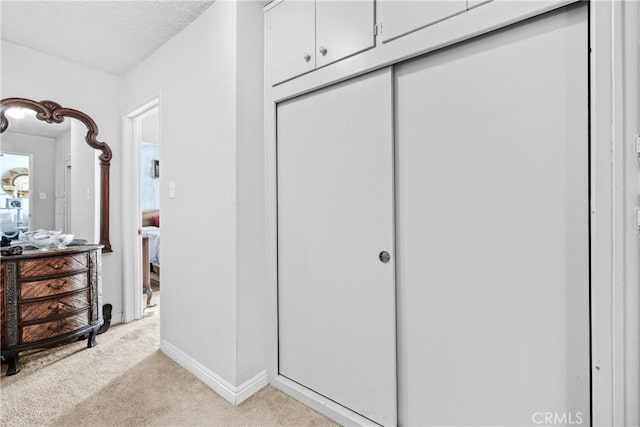 120 Alamitos Ave Unit 14, Long Beach, CA 90802 - hallway featuring light carpet and a textured ceiling