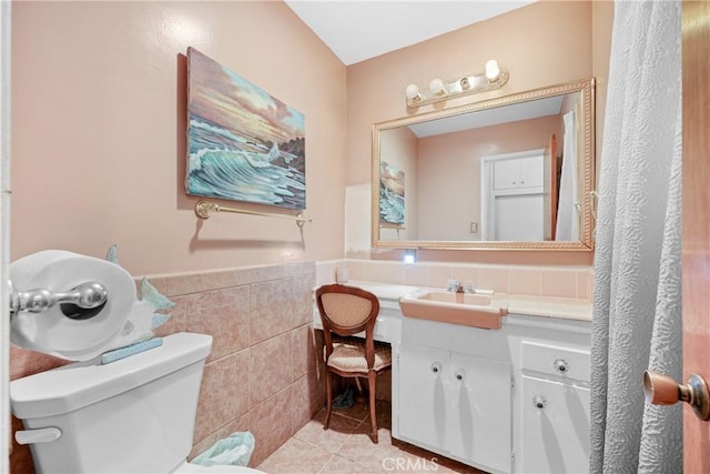 120 Alamitos Ave Unit 14, Long Beach, CA 90802 - bathroom with tile walls, vanity, tile patterned flooring, and a wainscoted wall